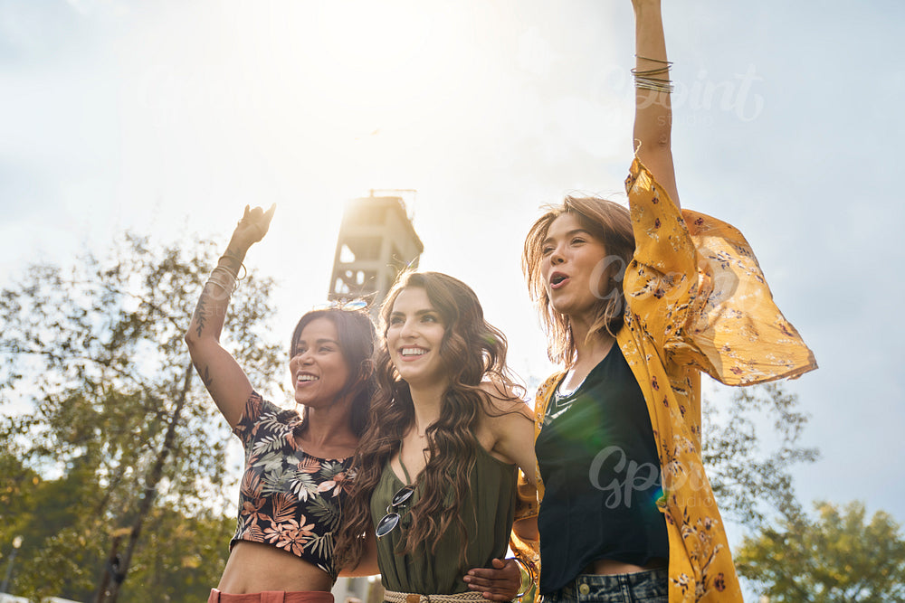 Group of women dancing at music festival 