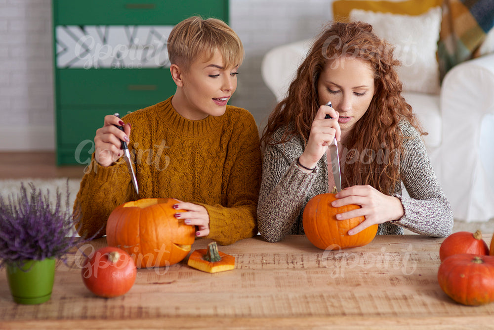Girls making decorations for Halloween