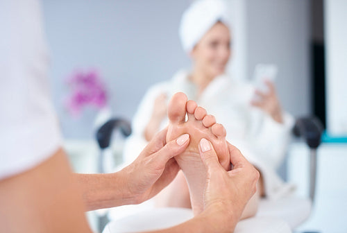 Massage of feet at spa salon