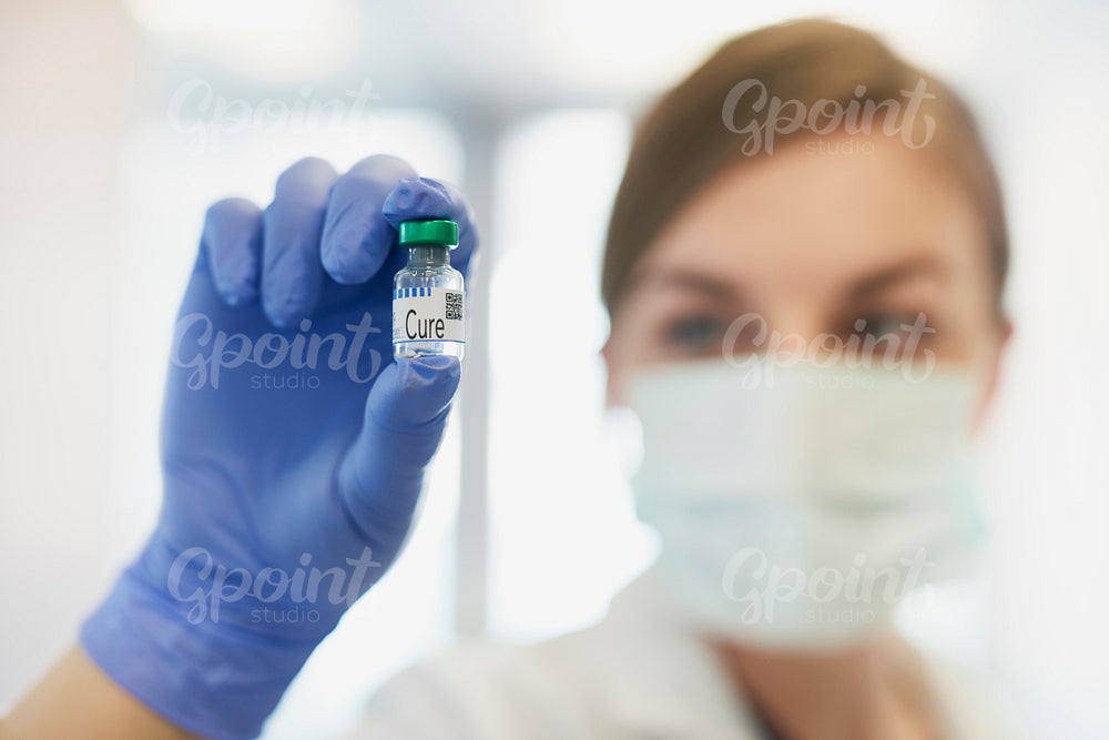 Doctor holding a remedy for the illness