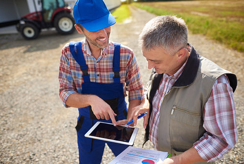 High angle view on modern farmers with digital tablet