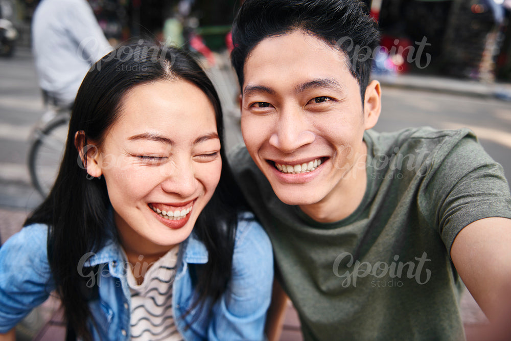 Selfie of Vietnamese couple in the city