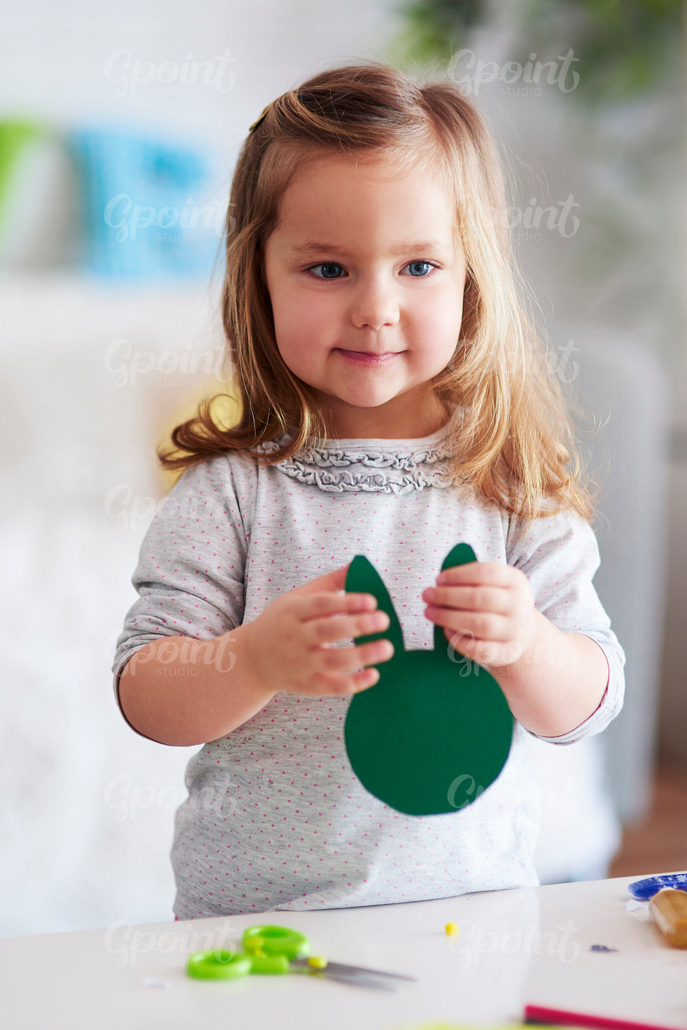 Cute girl holding handmade easter decorations