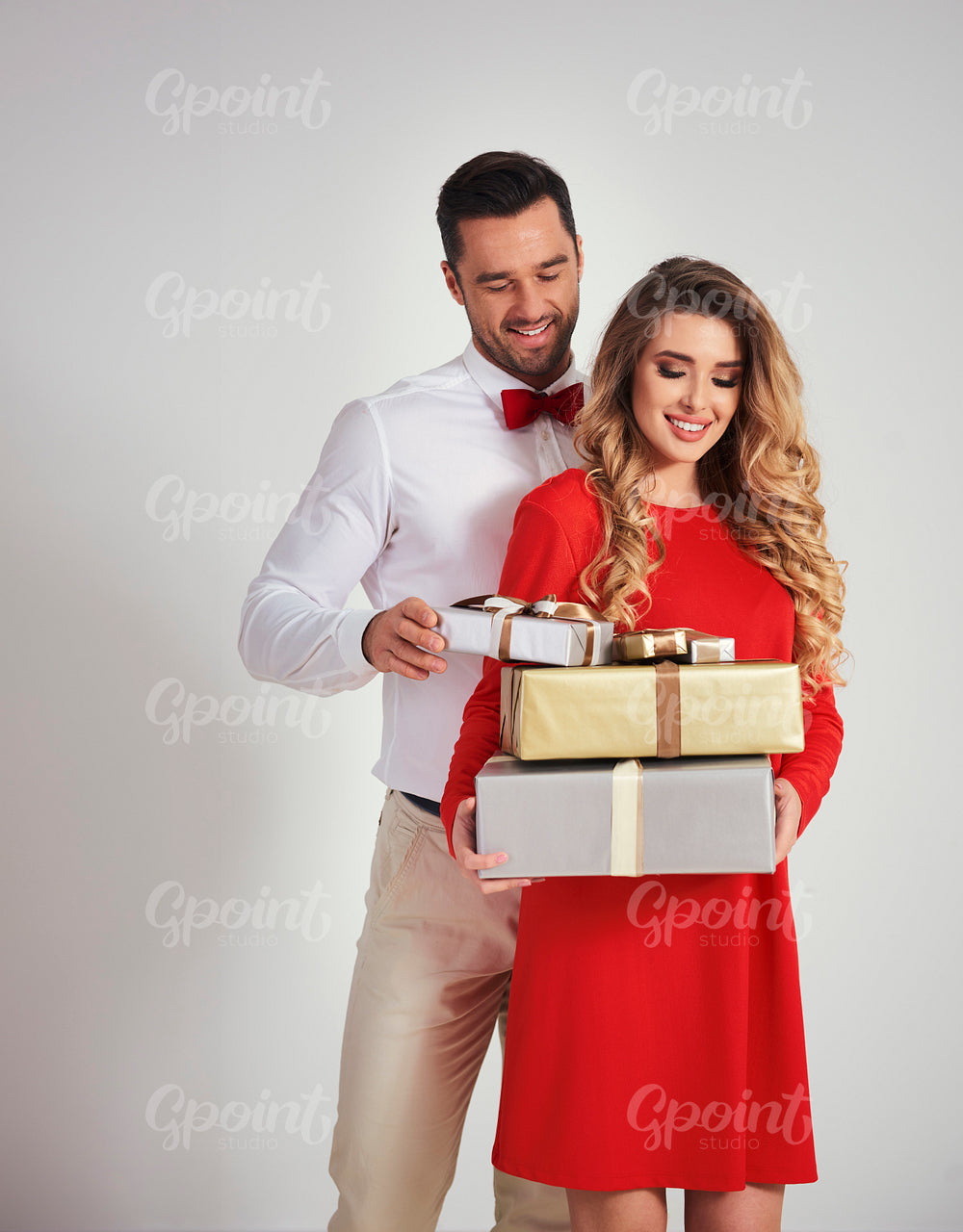 Elegant man giving woman the gifts