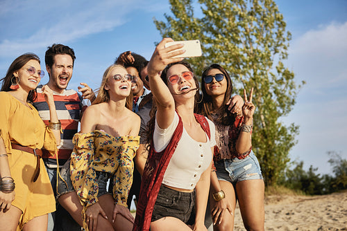 Young smiling people taking a selfie