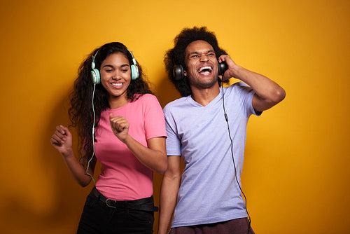 Couple having fun while listening to music