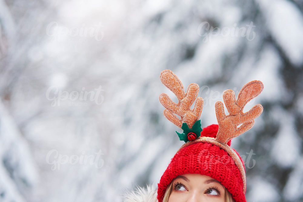 Close up of woman in Christmas costume peeking
