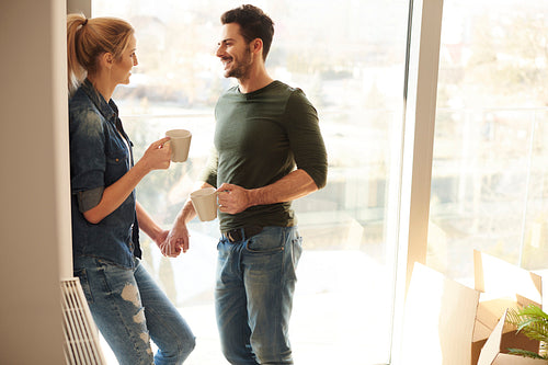 Couple inside new home during coffee break