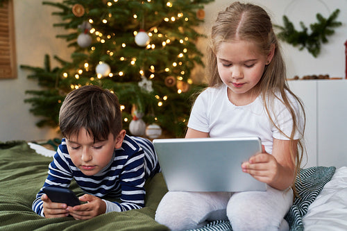 Kids spending Christmas with wireless technology