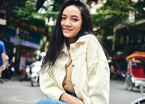 Portrait of young Vietnamese woman in the city