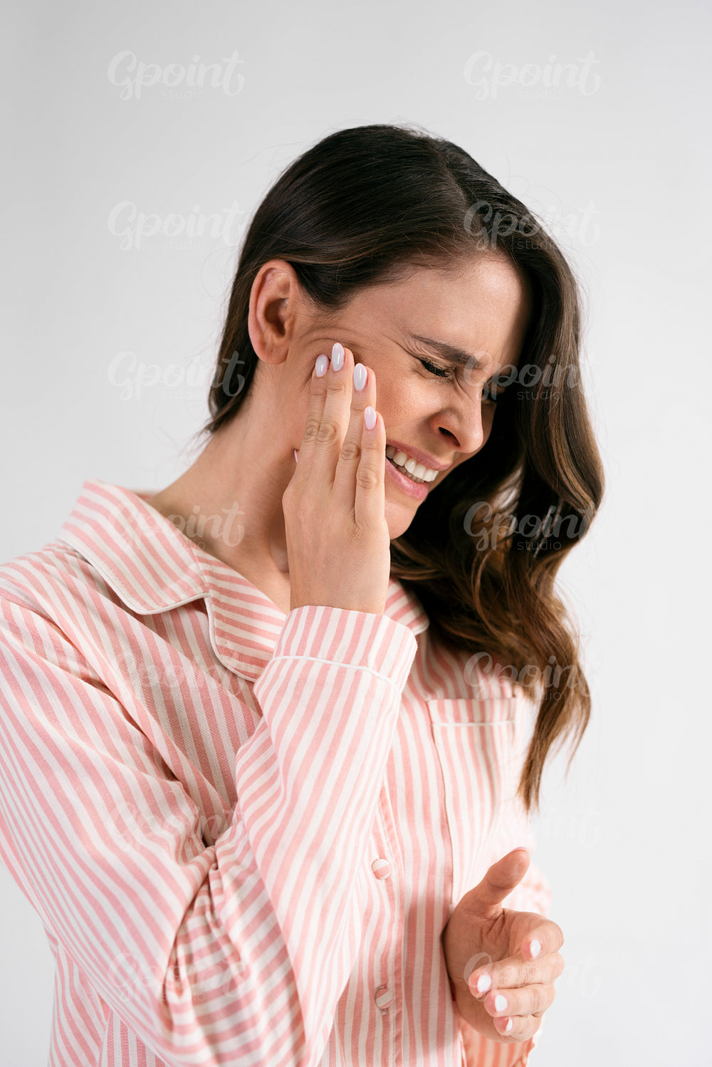 Young woman suffering from toothache