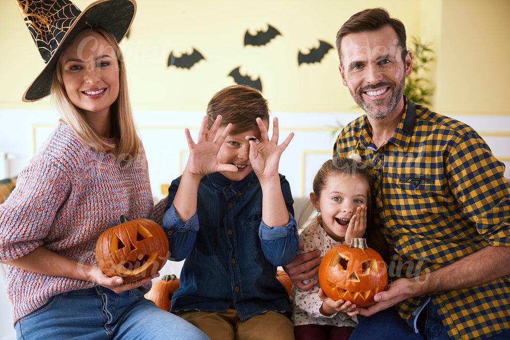 Portrait of family and halloween pumpkins