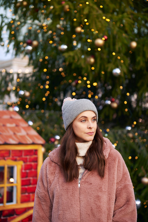 Woman in warm clothes on Christmas market