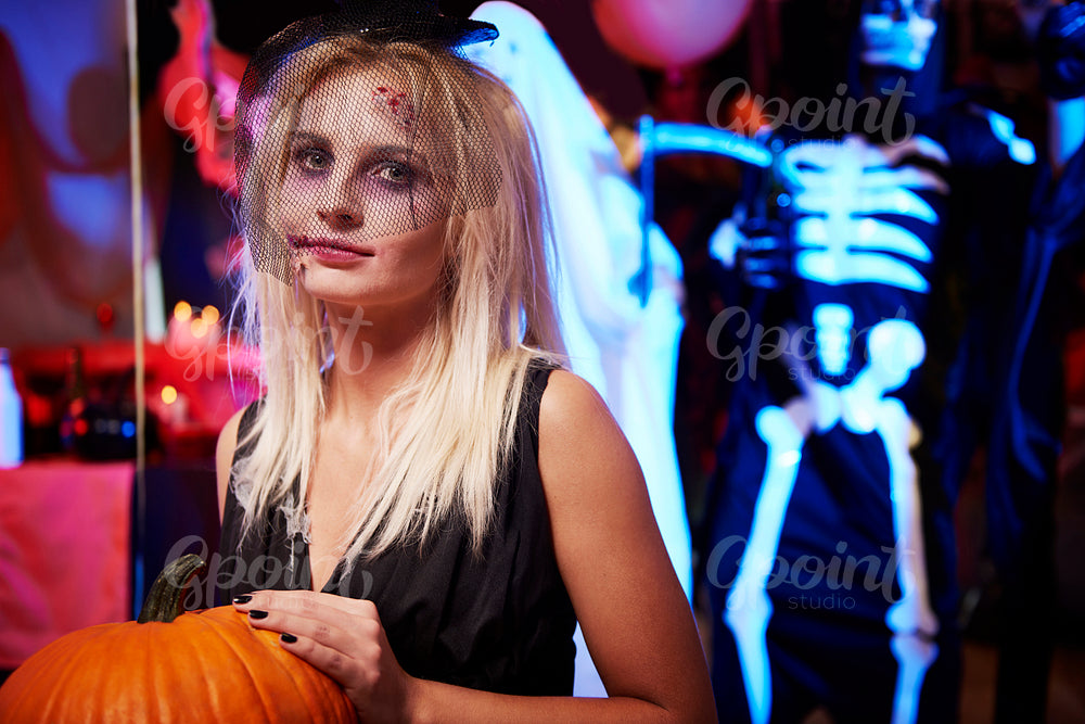Creepy woman with big pumpkin