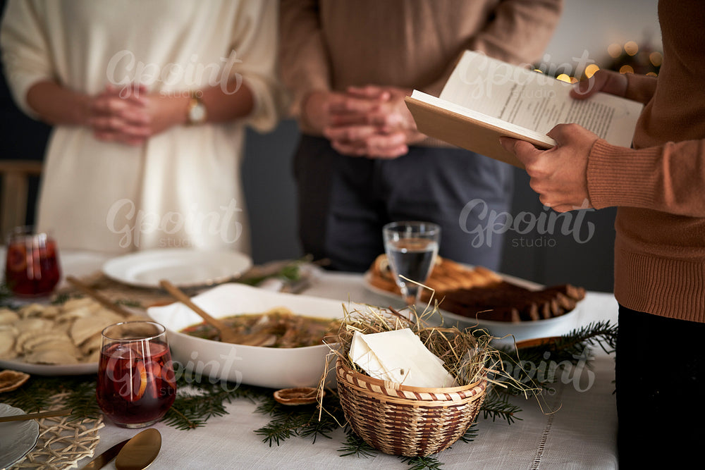 Close up of family praying in Christmas Eve 