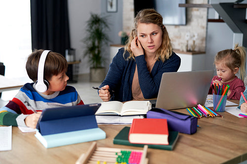 Mother during home office with children at home