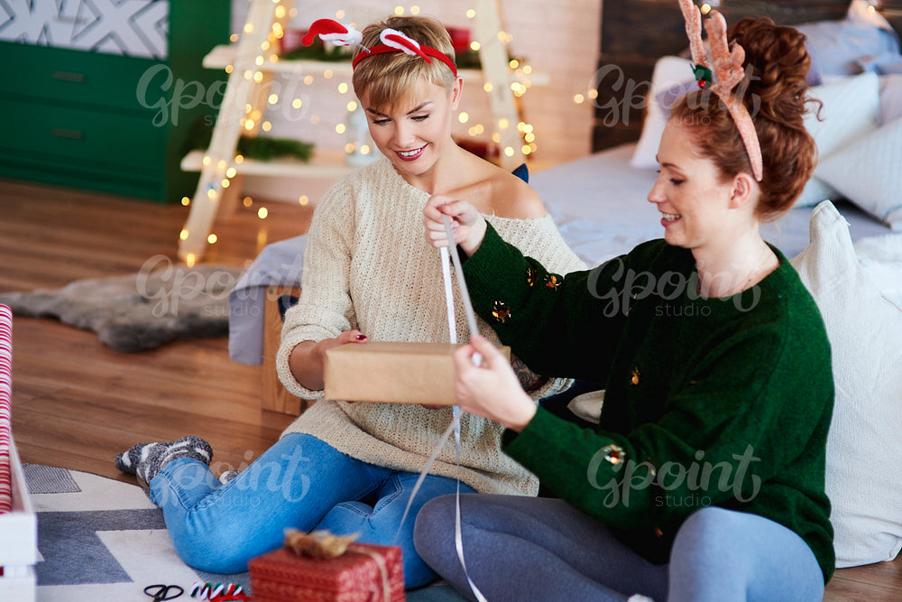 Two girls preparing christmas gifts for Christmas