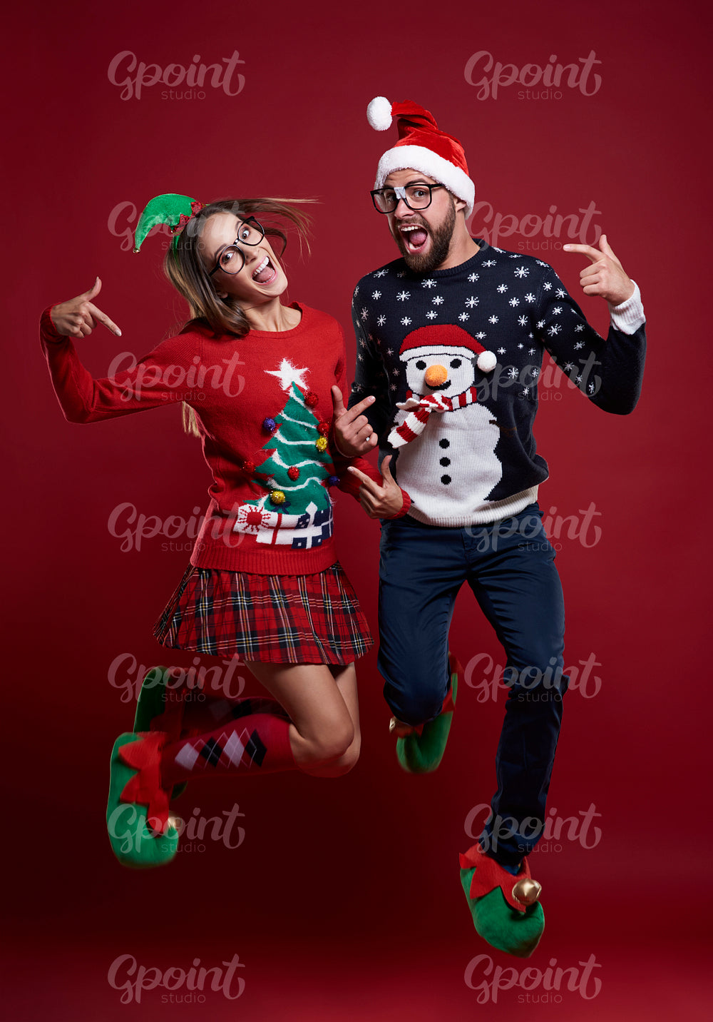 Christmas couple jumping very high