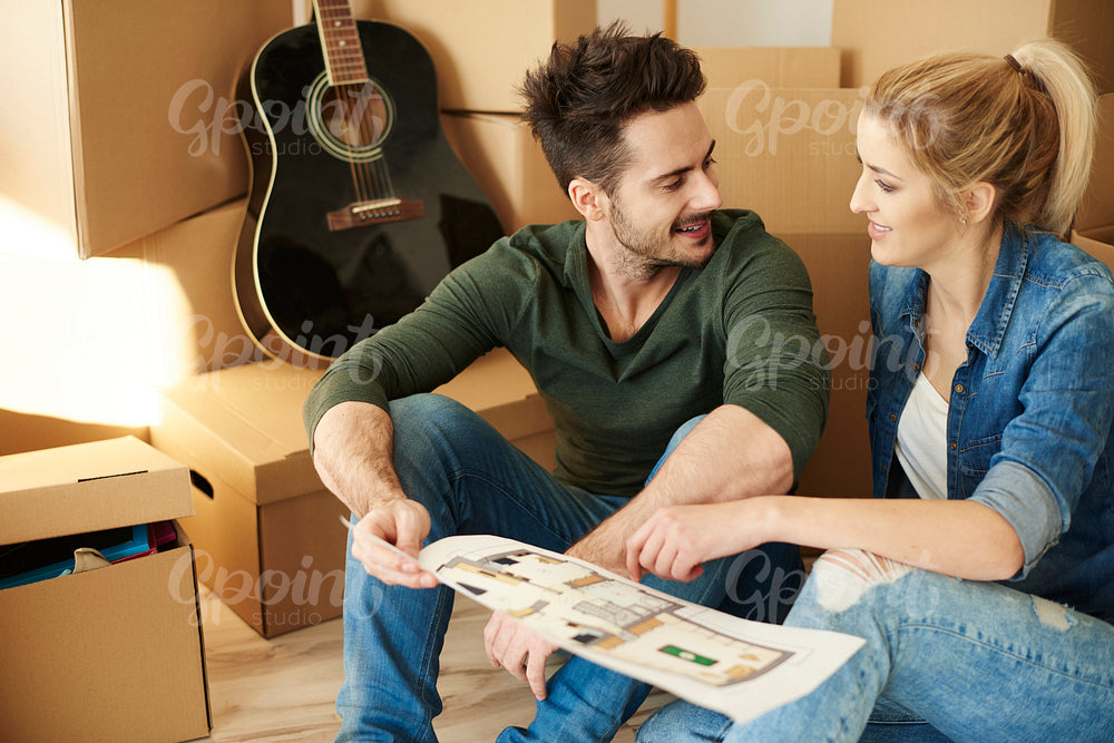 Couple deciding where to put the rest of things