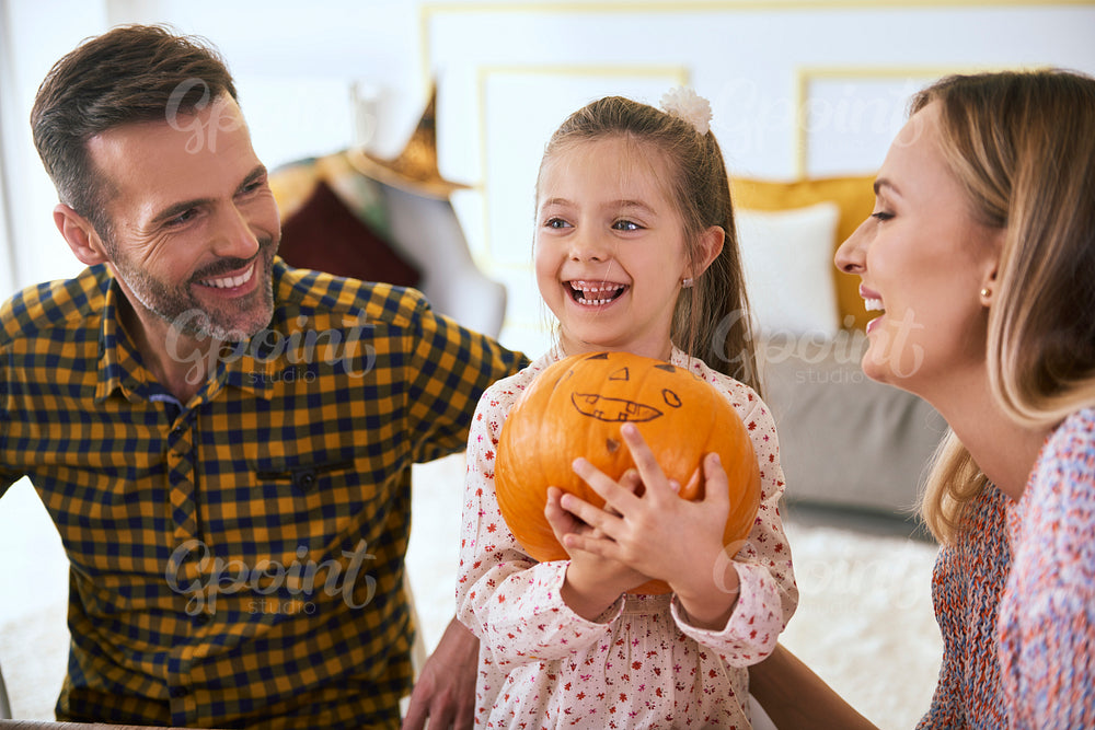 Happy family with halloween pumpkin