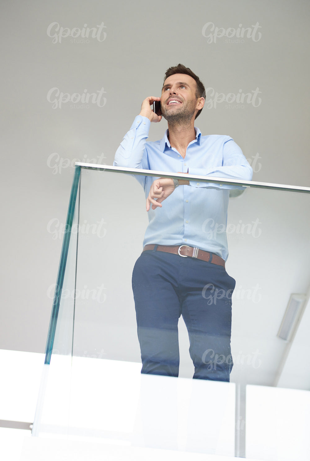 Man with phone in the modern company