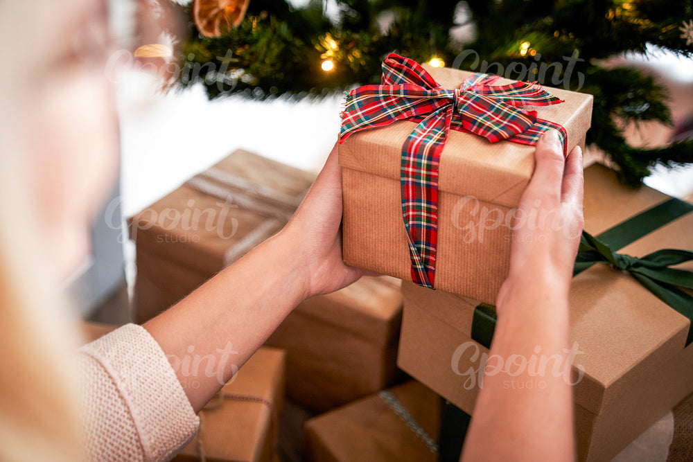 Close up of woman with Christmas present