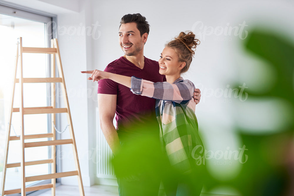 Young couple making plans for home improvement