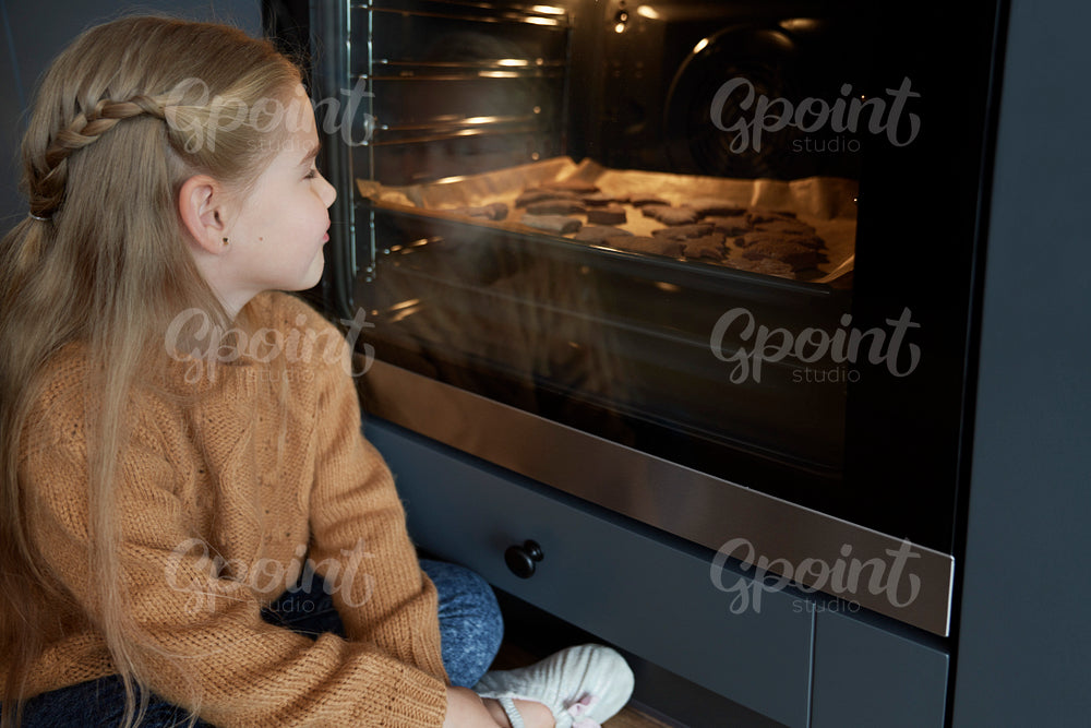 Little girl cannot wait for homemade cookies