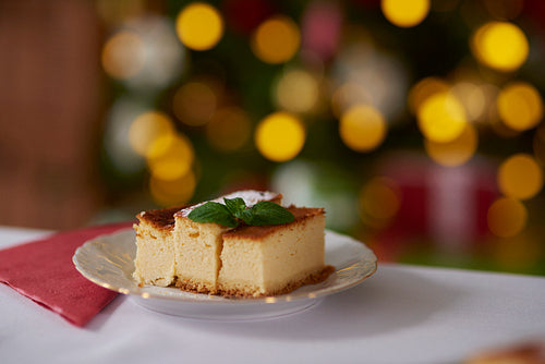 Cheesecake decorated with a mint leaf