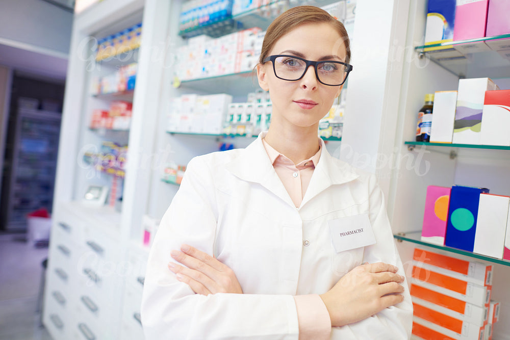 Portrait of confident pharmacist at drug store