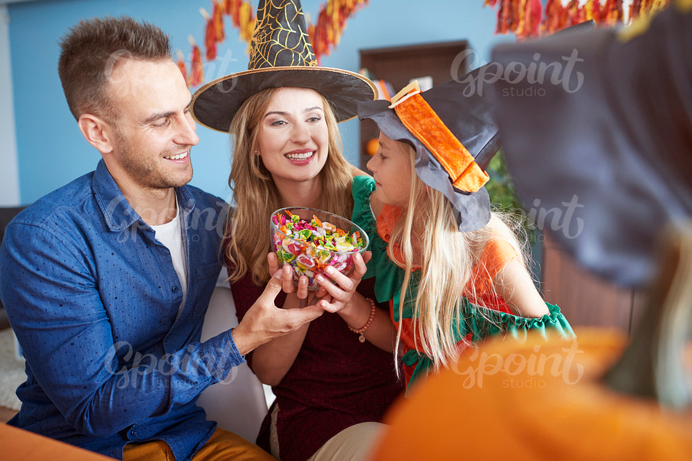 Parents giving the candies in Halloween