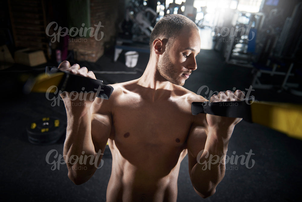 Young man focus on biceps parts
