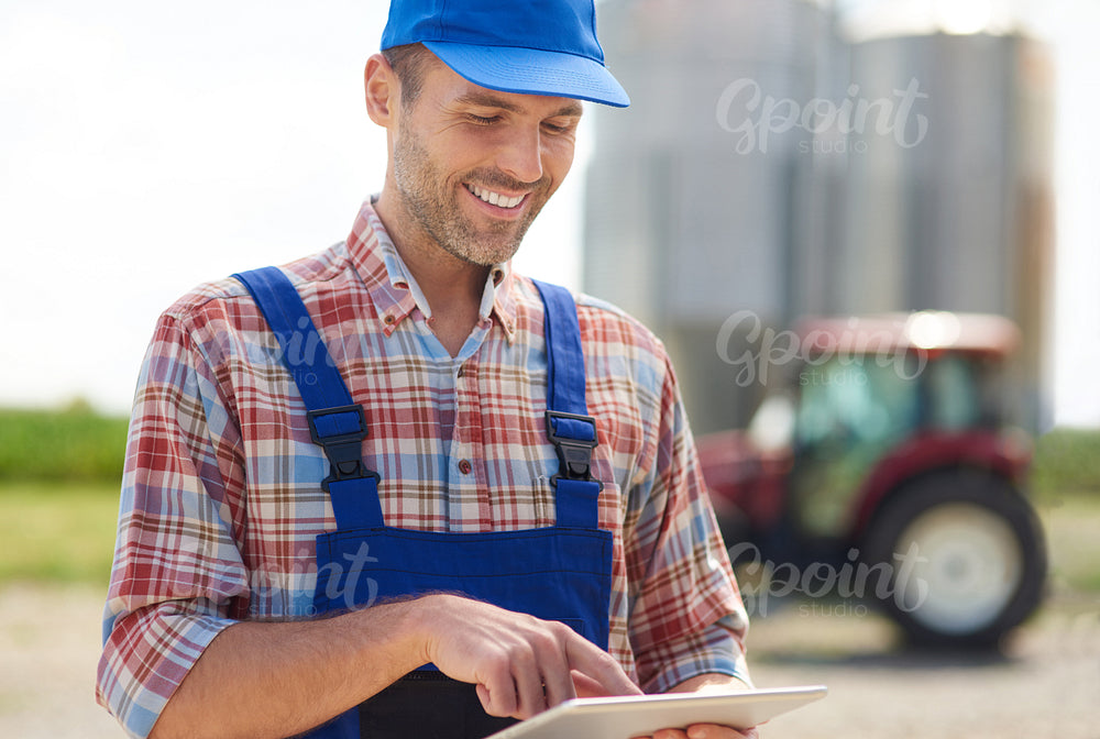 Farmer browsing a digital tablet