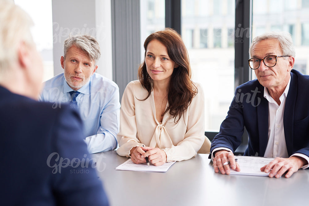 Serious, business talks at conference table