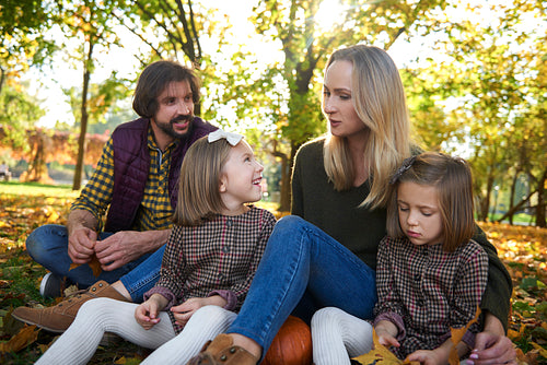 Happy family in autumn woods