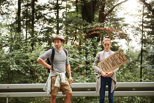 Portrait of young couple backpacking