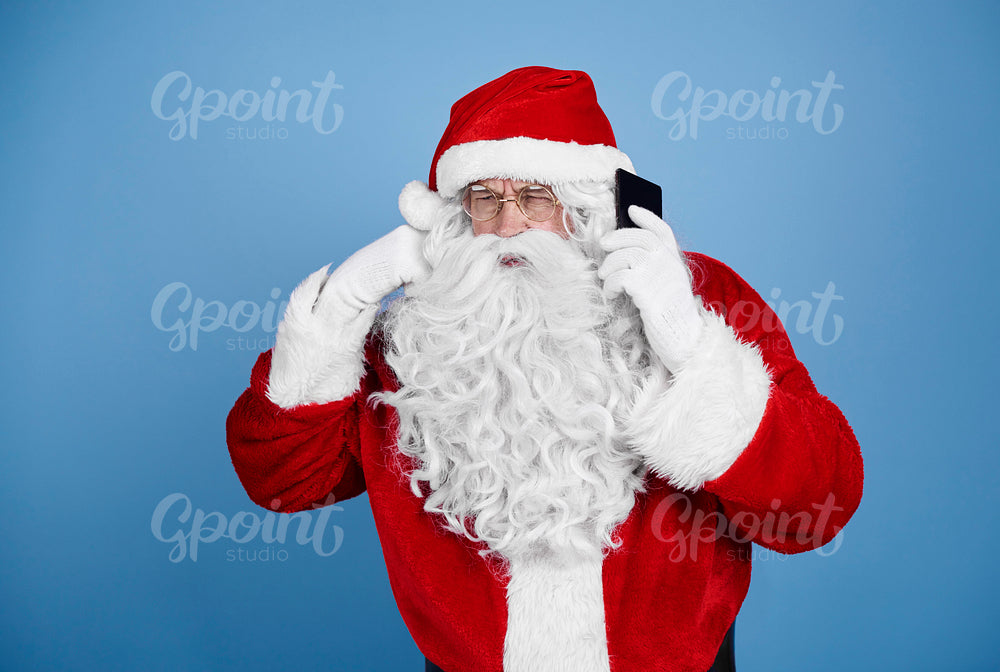 Santa claus talking by mobile phone