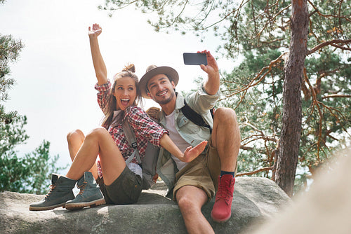 Young couple making a selfie during hiking trip