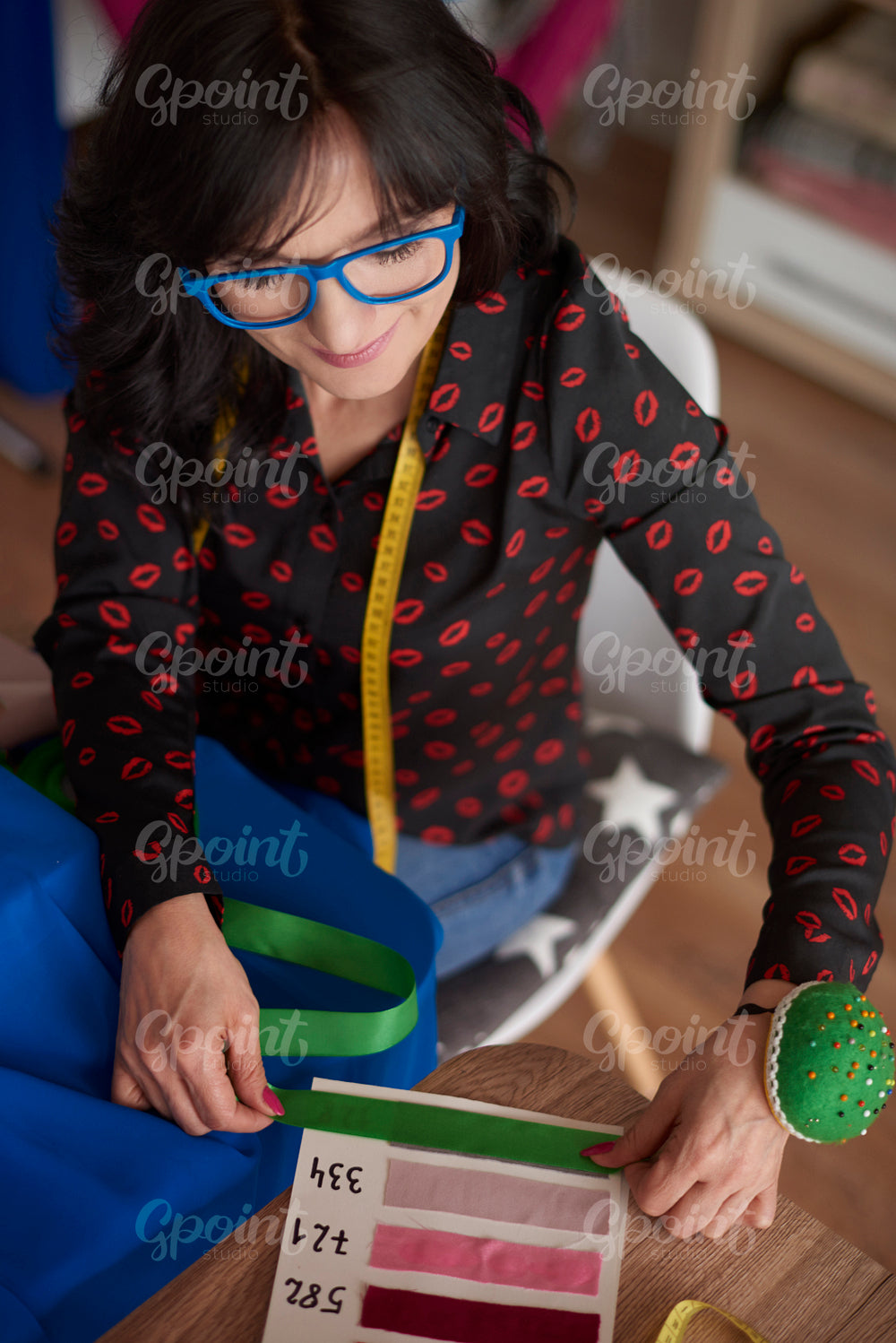 Woman using a fabric pattern board
