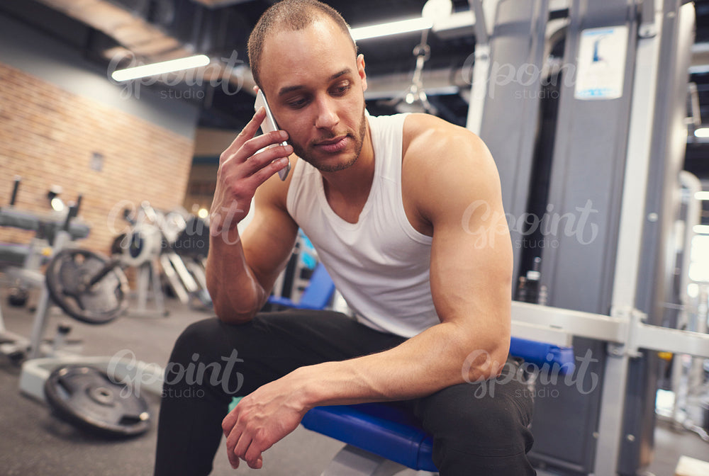 Male athlete having a call over training