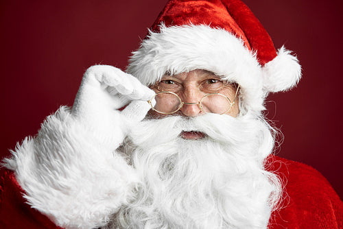 Close up of Santa Claus on the red background