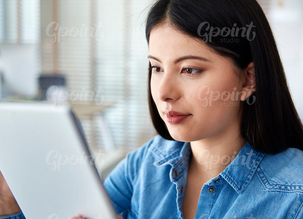Real close up of woman with a digital tablet