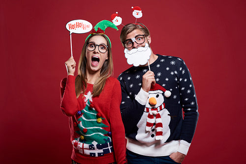 Couple with funny christmas masks