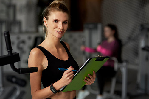 Portrait of female fitness instructor at the gym