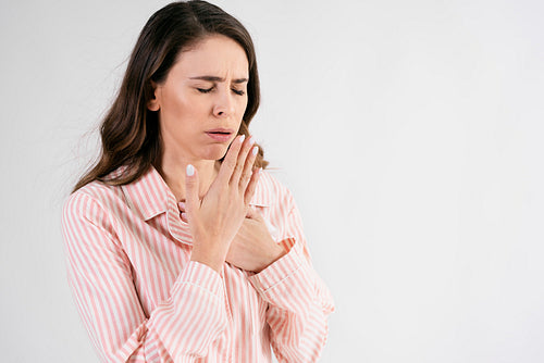 Young woman suffering from cough