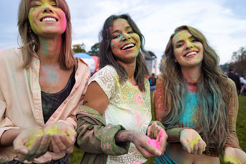 Group of friends looking at camera at Holi Festival