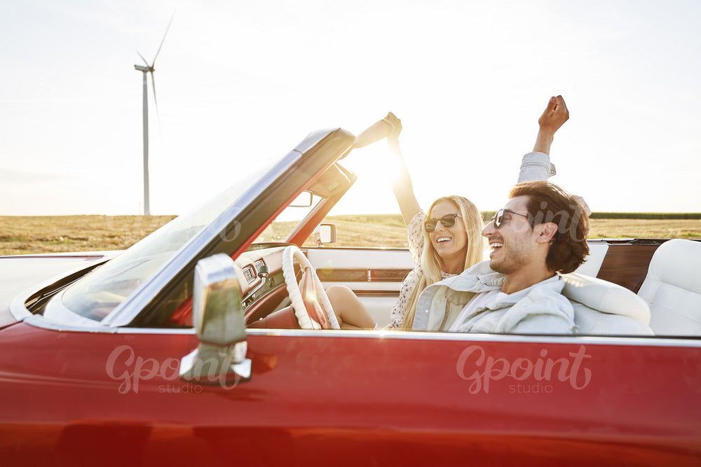 Side view of carefree couple on an unforgettable road trip