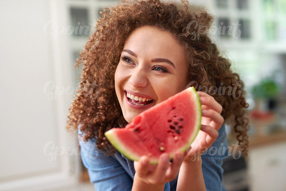 Woman with a slice of watermelon