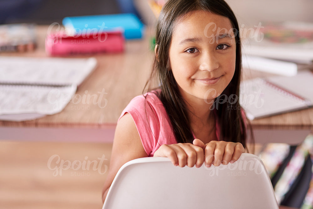 Asian ethnicity girl sitting on the chair
