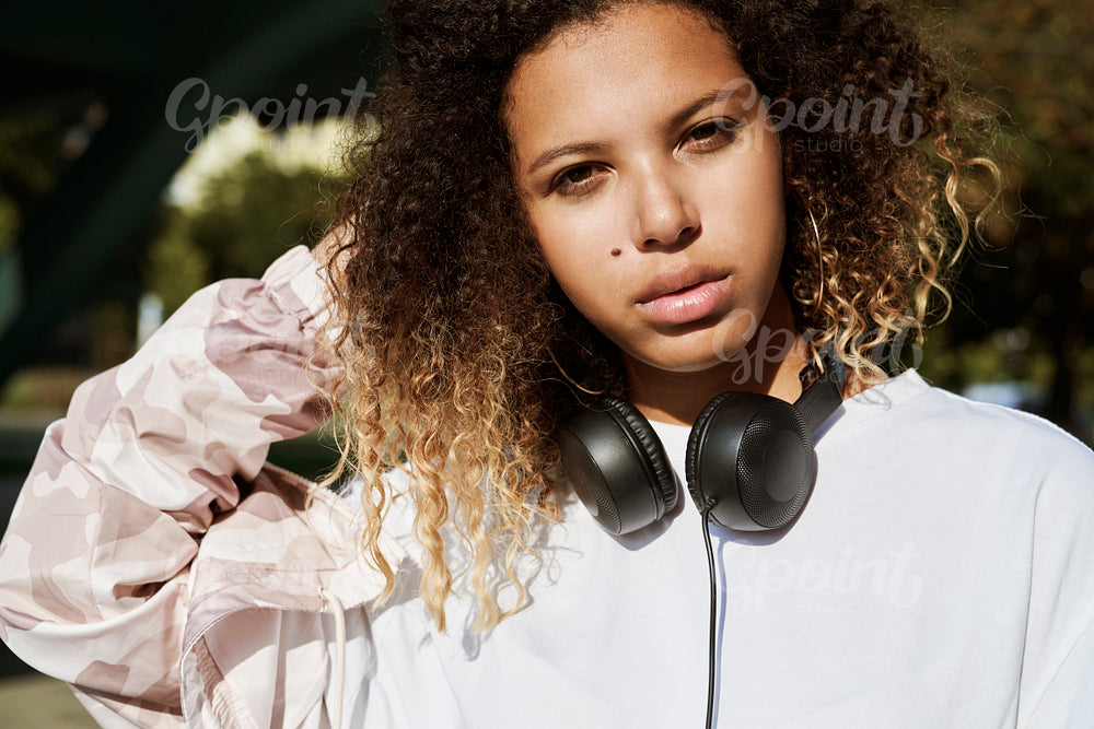 Close up portrait of African woman with headphones
